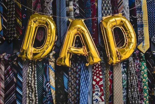 Gold balloons spelling out DAD