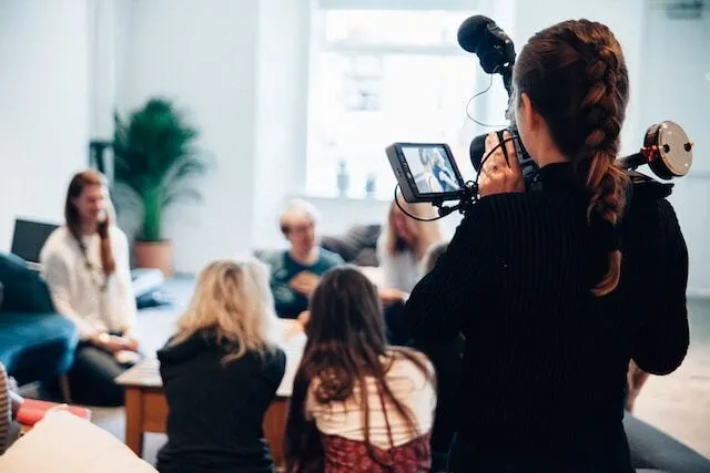 Videographer recording a marketing video
