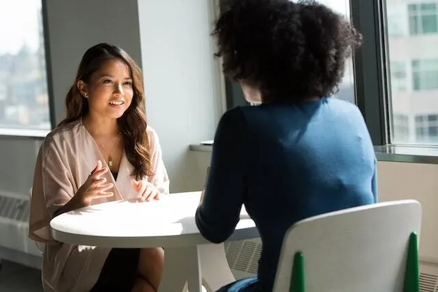 Two female friends having a conversation