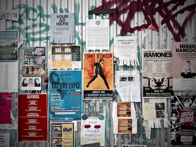 Collage of flyers posted on a wall