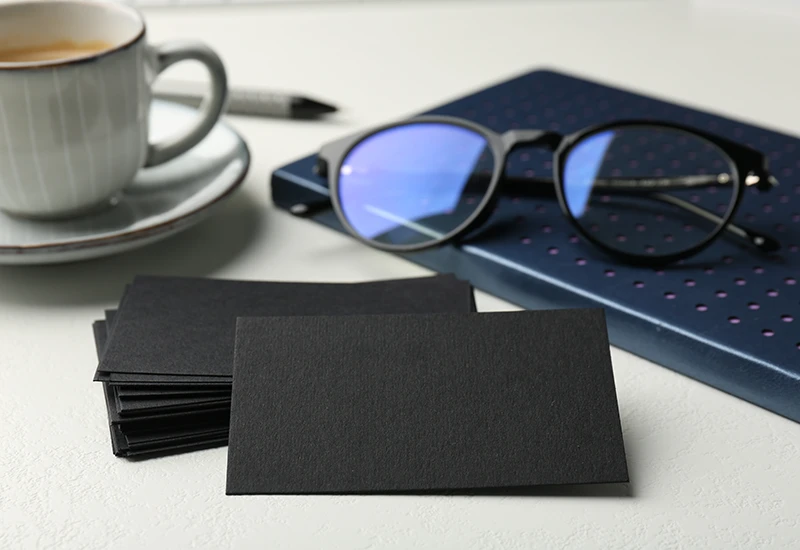 Stack of plain black uncoated business cards